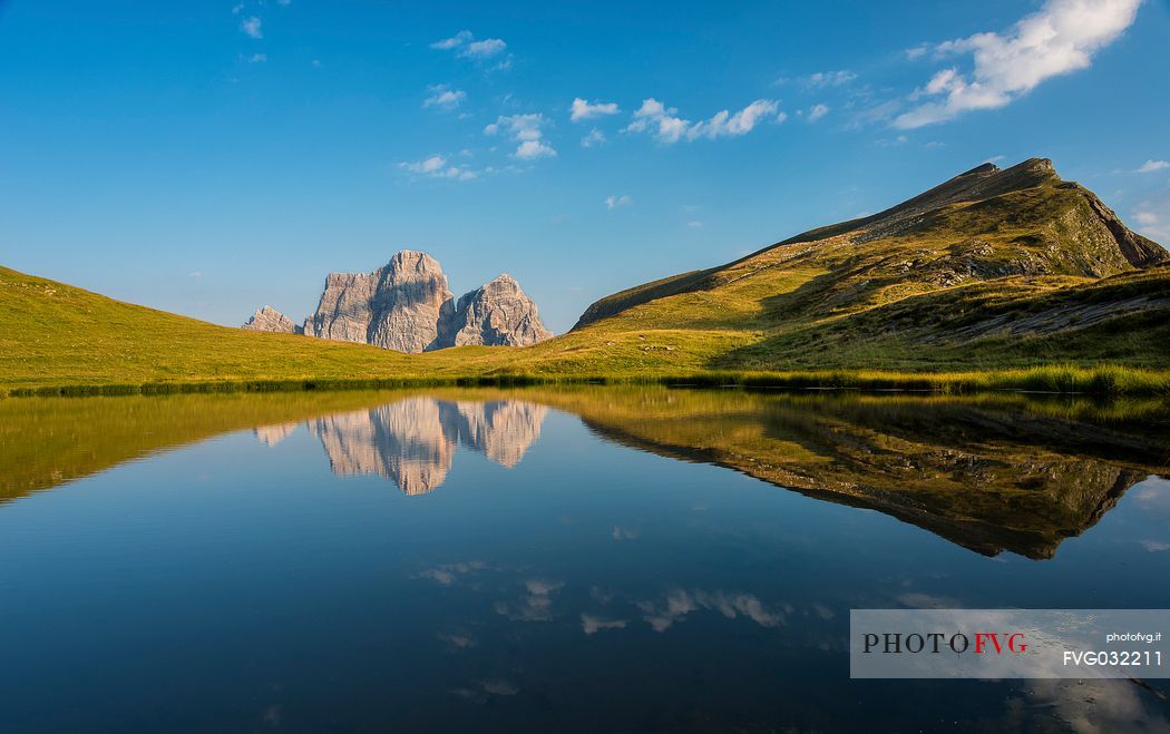 Mount Pelmo is reflected on the lake of the Baste, Mondeval, dolomites, Italy