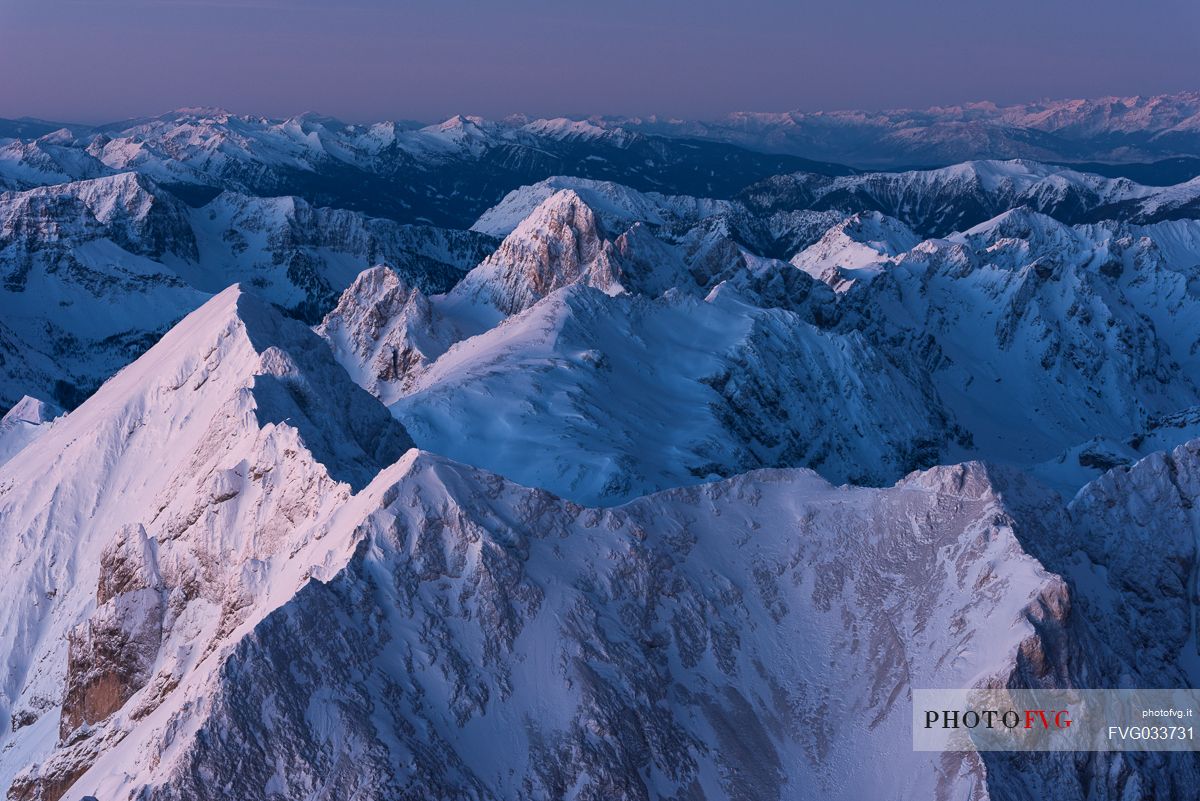 Sunrise from Punta Penia in the Marmolada mountain group, the highest peak of Dolomites, Italy