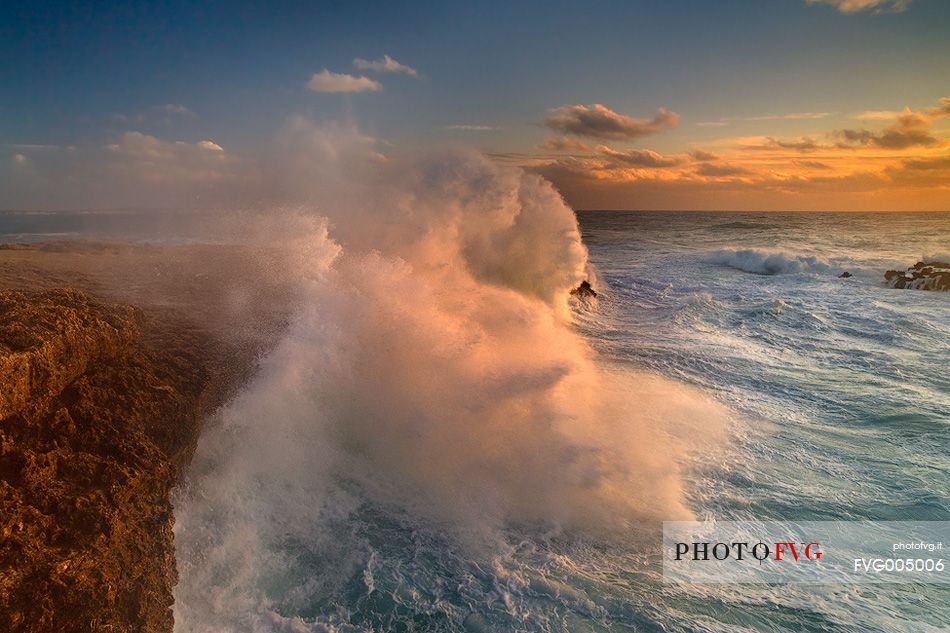 A wave fringes on the rocks of Capo Mannu with all its power. The high cliff about seven meters, it is submerged in water and leave in the eyes of the curious, wonder and awe, fear and fascination.