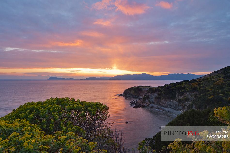 A colorful sunset is the backdrop to Cape Teulada in southern Sardinia, Portu Malu, Sulcis-Iglesiente, Sardinia, Italy