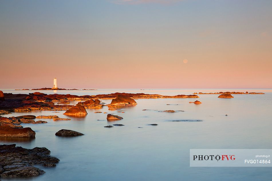 The Mangiabarche lighthouse overlooking the bay of the same name and is a point of interest for landscape photographers of the most famous in Sardinia, dawn or dusk or during a storm this pretty little bay is full of great energy, Sant'Antioco, Sulcis-Iglesiente, Sardinia, Italy