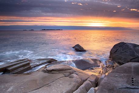 One of the most beautiful places in Sardinia: Punta Molentis at sunset with Serpentara Island in the background, Villasimius, Cagliari, Sardegna, Sardinia, Italy, Italia One of the most beautiful places in Sardinia: Punta Molentis at sunset with Serpentara Island in the background, Villasimius, Cagliari, Sardegna, Sardinia, Italy, Italia
