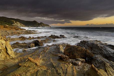 At sunset a storm invests the south west coast of Sardinia in location Piscinn, Sulcis-Iglesiente, Sardinia, ,Italy