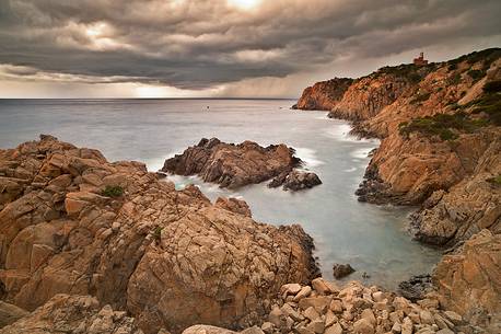 A very impressive stretch of reef is represented by these rocks in Cala Cipolla (South West Sardinia), photographed here while a storm is about to fall on the coast A very impressive stretch of reef is represented by these rocks in Cala Cipolla (South West Sardinia), photographed here while a storm is about to fall on the coast
