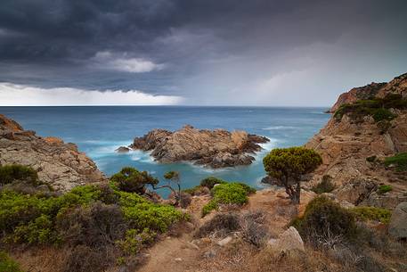 A very impressive stretch of reef is represented by these rocks in Cala Cipolla (South West Sardinia), photographed here while a storm is about to fall on the coast A very impressive stretch of reef is represented by these rocks in Cala Cipolla (South West Sardinia), photographed here while a storm is about to fall on the coast