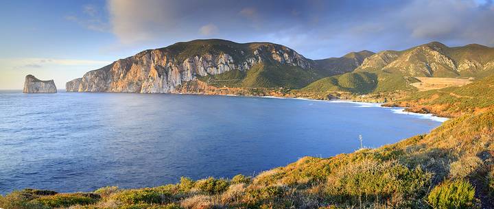 Panoramic view in location Masua, and in the background the well-known cliff of Panoramic view in location Masua, and in the background the well-known cliff of