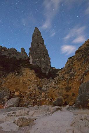Cala Goloritzè photographed during a full moon night. The stars frame the note pinnacle (143 mt) Cala Goloritzè photographed during a full moon night. The stars frame the note pinnacle (143 mt)