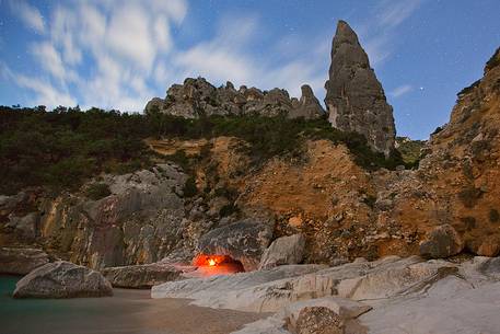 Cala Goloritzè photographed during a full moon night. The stars frame the note pinnacle (143 mt) Cala Goloritzè photographed during a full moon night. The stars frame the note pinnacle (143 mt)