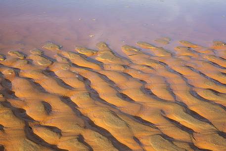 Detail of Piscinas dunes, the colors of a warm sunset, the dunes, the desert of Sardinia, a place full of magic, unique in the Mediterranean, Arbus, Sardinia, Italy Detail of Piscinas dunes, the colors of a warm sunset, the dunes, the desert of Sardinia, a place full of magic, unique in the Mediterranean, Arbus, Sardinia, Italy