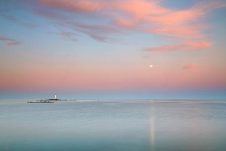 The Mangiabarche lighthouse overlooking the bay of the same name and is a point of interest for landscape photographers of the most famous in Sardinia, dawn or dusk or during a storm this pretty little bay is full of great energy, Sant'Antioco, Sulcis-Iglesiente, Sardinia, Italy