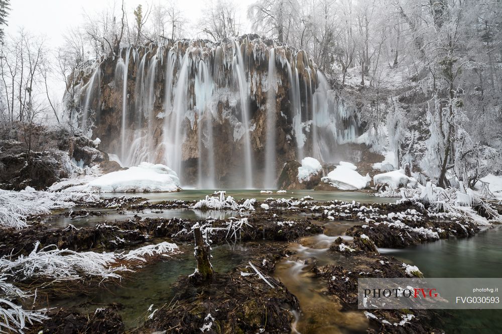 Winter waterfall in Plitvice Lakes National Park, Lika-Senj County, Karlovac County, Croatia.