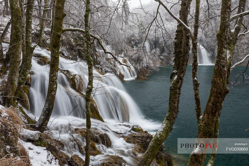 Winter waterfall in Plitvice Lakes National Park, Lika-Senj County, Karlovac County, Croatia.