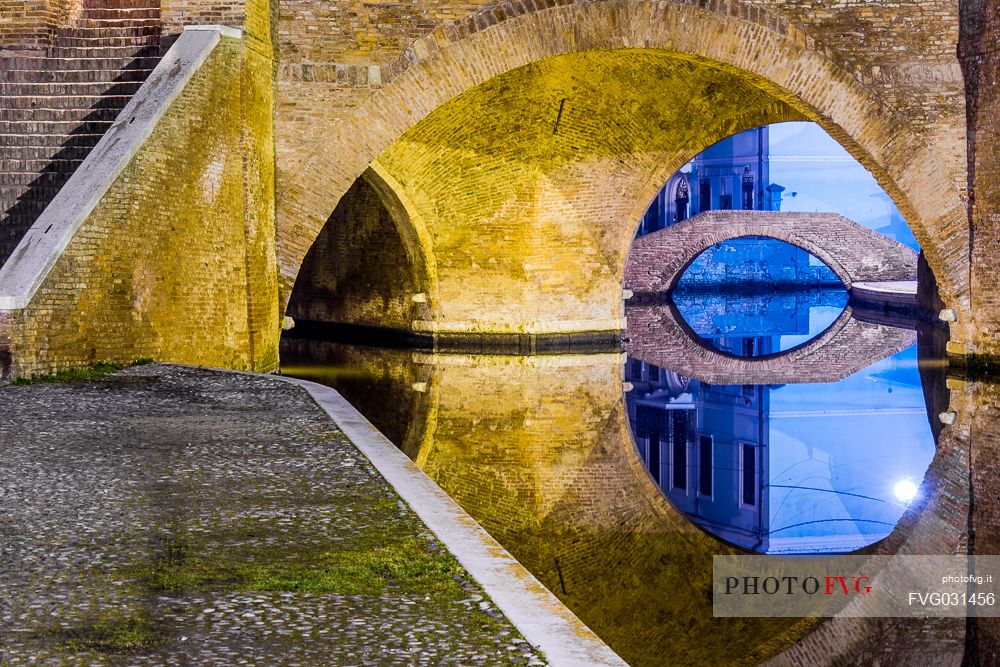 Details and reflections of Triple bridge, Ponte dei Trepponti, called Ponte Pallotta, Comacchio town, Ferrara, Emilia Romagna, Italy