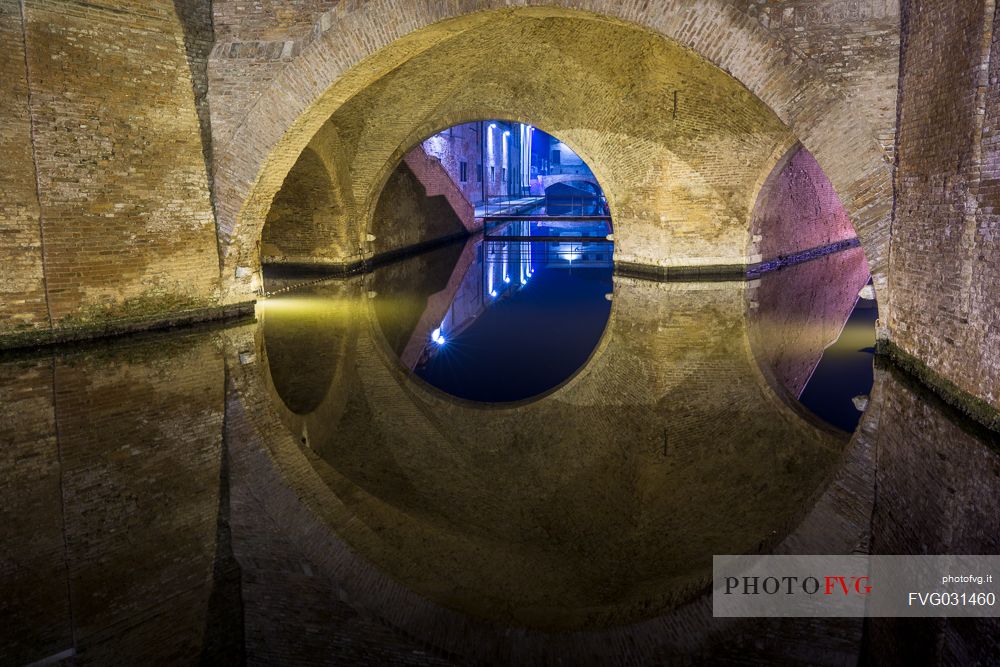 Details and reflections of Triple bridge, Ponte dei Trepponti, called Ponte Pallotta, Comacchio town, Ferrara, Emilia Romagna, Italy