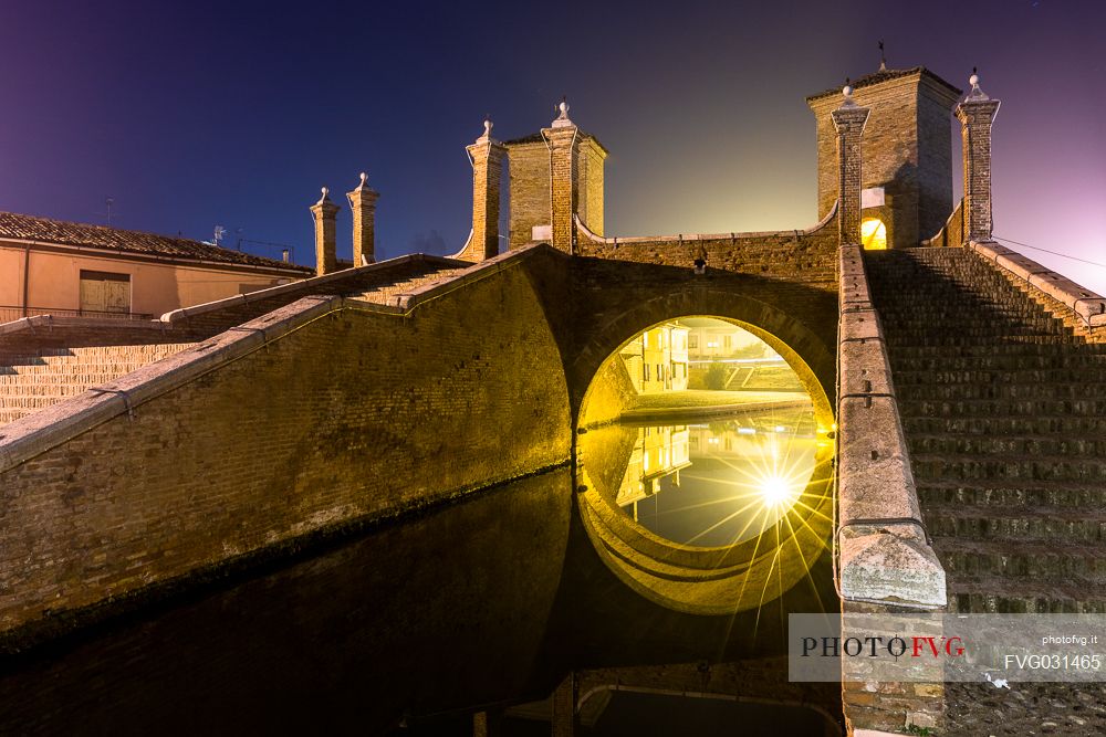 Details and reflections of Triple bridge, Ponte dei Trepponti bridge, called Ponte Pallotta, Comacchio town, Ferrara, Emilia Romagna, Italy