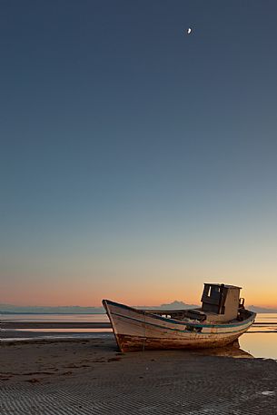 Boat wreck in Grado beach, Friuli Venezia Giulia, Italy Boat wreck in Grado beach, Friuli Venezia Giulia, Italy