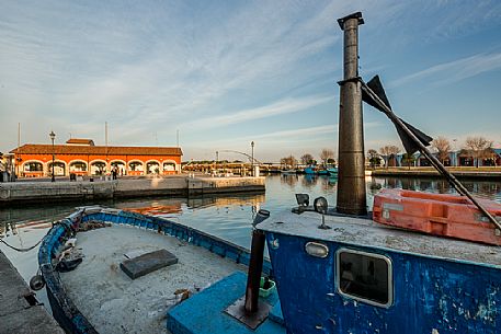 Fishing boats moored in the port of Marano Lagunare village, Friuli Venezia Giulia, Italy