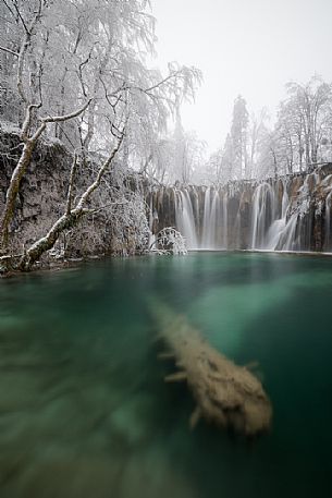 Winter waterfall in Plitvice Lakes National Park, Lika-Senj County, Karlovac County, Croatia.