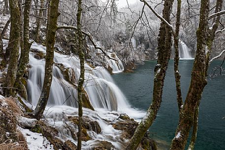 Winter waterfall in Plitvice Lakes National Park, Lika-Senj County, Karlovac County, Croatia.