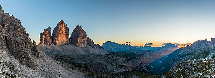 The north faces of the Tre Cime di Lavaredo, three peaks of Lavaredo, at sunset, Sexten Dolomites, Italy.