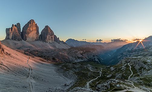 The north faces of the Tre Cime di Lavaredo, three peaks of Lavaredo, at sunset, Sexten Dolomites, Italy.