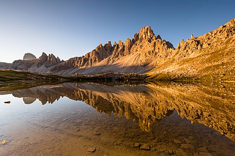 Sunrise at The Laghi dei Piani lake near Tre Cime di Lavaredo peak, Sexten Dolomites, Tre Cime natural park, Italy