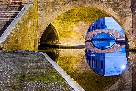 Details and reflections of Triple bridge, Ponte dei Trepponti, called Ponte Pallotta, Comacchio town, Ferrara, Emilia Romagna, Italy