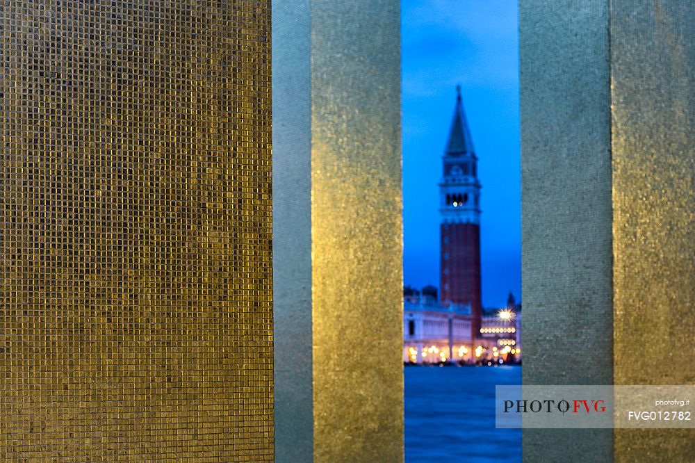 Glimpse on San Marco bell tower from The Sky Over Nine Columns sculpture at twilight, San Giorgio island, Venice, Italy, Europe