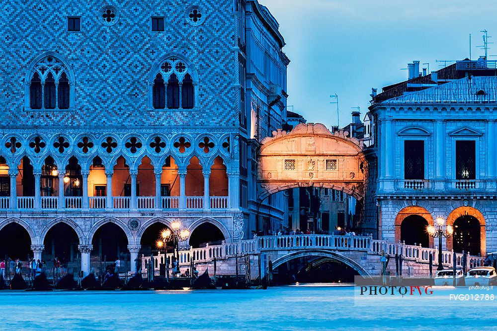 View of Bridge of Sighs or Ponte dei Sospiri illuminated at twilight and Palazzo Ducale, Venice, Italy, Europe