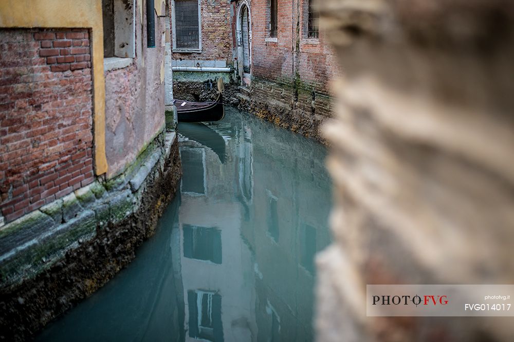 Detail of gondola on the narrow canal in Venice, Veneto, Italy, Europe