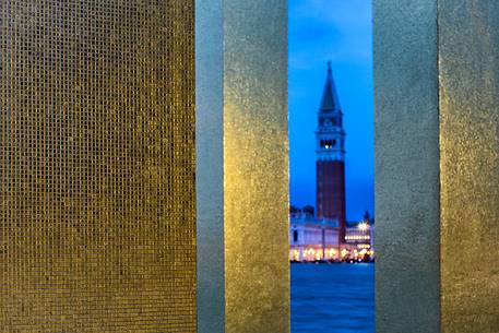 Glimpse on San Marco bell tower from The Sky Over Nine Columns sculpture at twilight, San Giorgio island, Venice, Italy, Europe