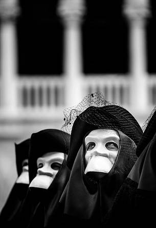 Group of Venetian masks during the carnival in Piazza San Marco or St Mark's Square, Venice, Italy, Europe