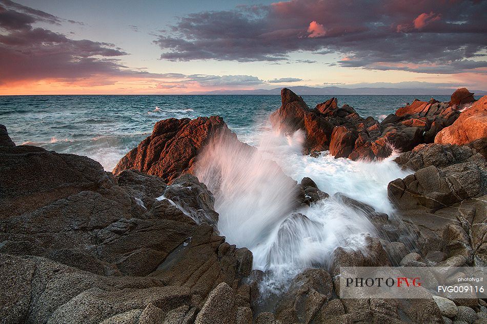 The essence of water and light captured during a winter sunset on the cliffs of Briatico Marina