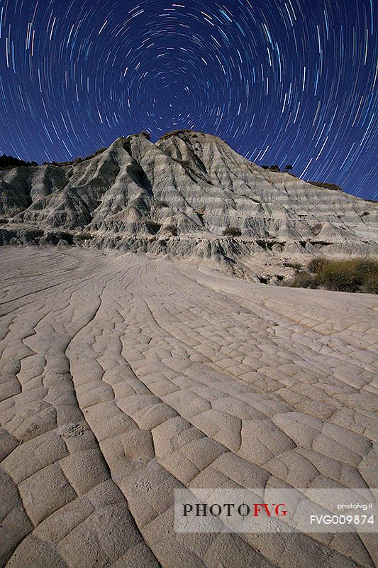 The badlands of Palizzi Marina illuminated by the light from the moon and the celestial vault crowned