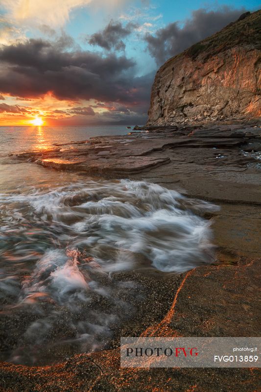 The cliff Leucopetra photographed at sunset from Cape Riaci