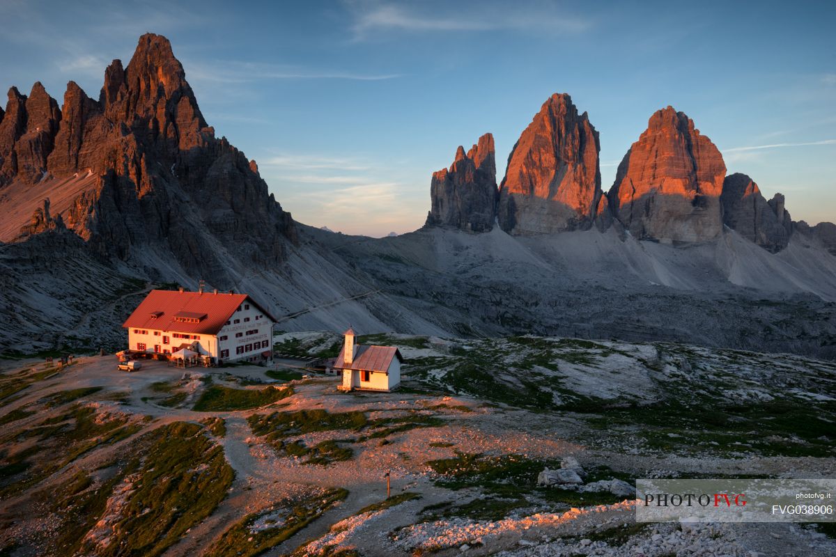 The Tre Cime of Lavaredo and the Locatelli refuge at the first light of dawn, Sexten dolomites, South Tyrol, Italy, Europe

