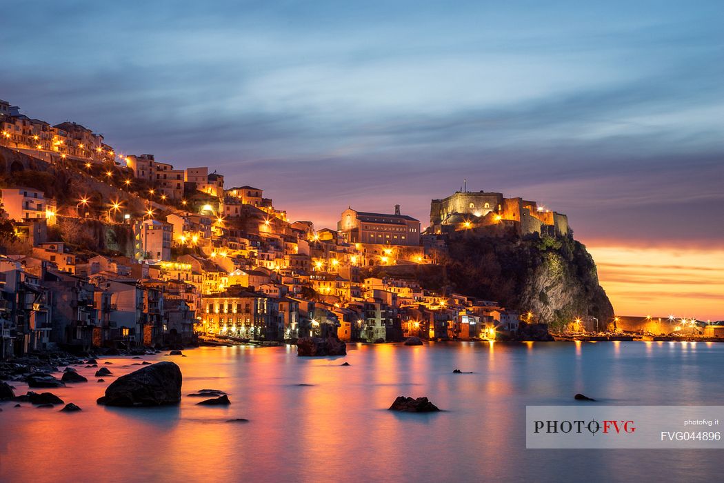 The village of Chianalea di Scilla with a view of the Ruffo Castle at sunset, Costa Viola, Calabria, Italy, Europe