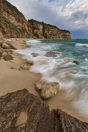 The strength of the rock and water come together in harmony Formicoli Beach, a short walk from Tropea.