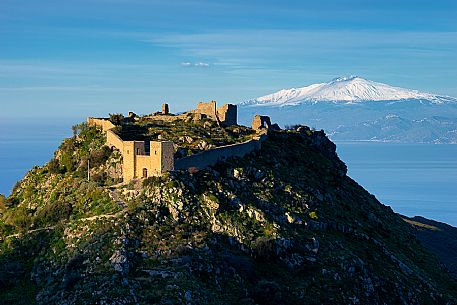 Castle of Sant'Aniceto, Sicily with Monti Peloritani and Mount Etna in background, Motta San Giovanni, Calbria, Italy Castle of Sant'Aniceto, Sicily with Monti Peloritani and Mount Etna in background, Motta San Giovanni, Calbria, Italy