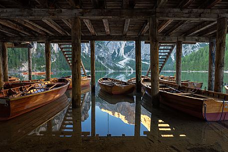 Boats moored in the Braies lake, south tyrol, dolomites, Italy, Europe