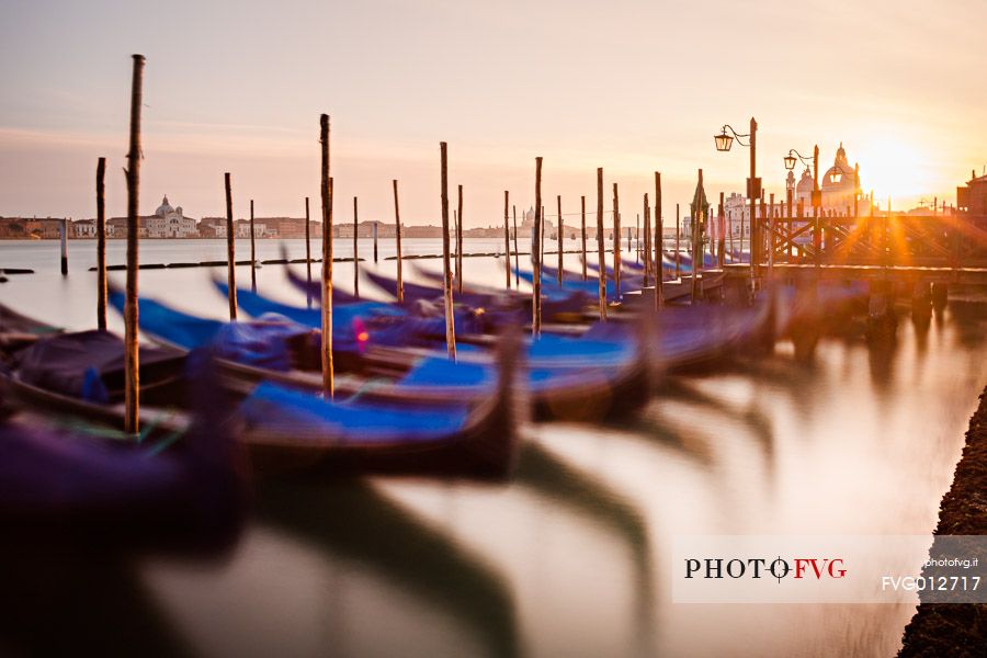 Gondolas at sunset, in the background the Church of San Giorgio Maggiore