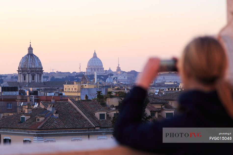 Girl photographing the view of Rome