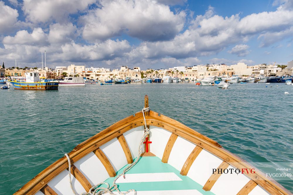 The historic city of Marsaxlokk on the island of Malta from Iuzzu, the typical colorful fishing boats.