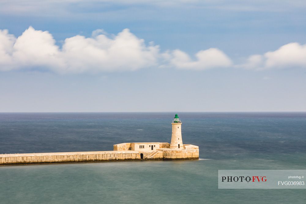 St. Elmo Breakwater Lighthouse, Grand Harbor, La Valletta, capital city of the island of Malta.