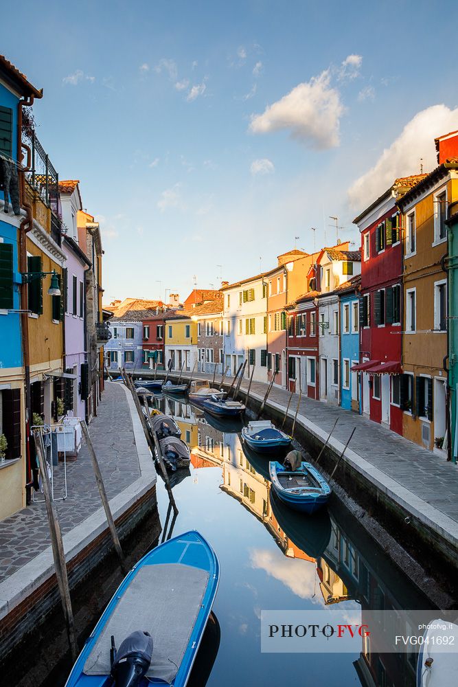 Colorful houses in Burano with canal and moored boats, Venice, Venetian lagoon, Veneto, Italy, Europe