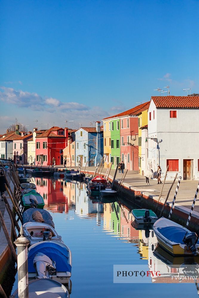 Colorful houses in Burano with canal and moored boats, Venice, Venetian lagoon, Veneto, Italy, Europe