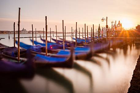 Gondolas at sunset, in the background the Church of San Giorgio Maggiore