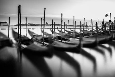 Gondolas at sunset, in the background the Church of San Giorgio Maggiore Gondolas at sunset, in the background the Church of San Giorgio Maggiore