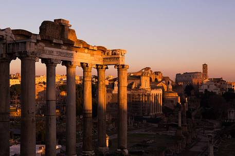 Sunset light on the Roman Forums, the Colosseum in the background Sunset light on the Roman Forums, the Colosseum in the background