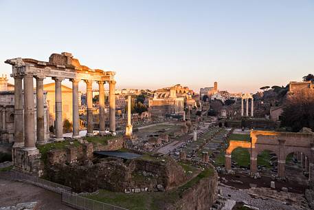 Sunset light on the Roman Forums, the Colosseum in the background Sunset light on the Roman Forums, the Colosseum in the background